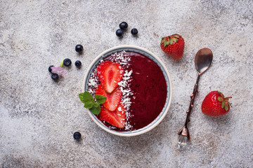 Smoothie bowls with strawberry and blueberry