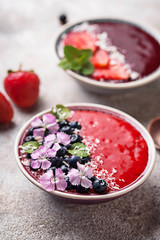 Smoothie bowls with strawberry and blueberry