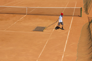 Cleaning of the tennis court. Court service. Cleaning of the ground for tennis.