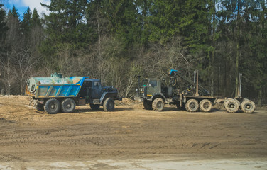 Obraz premium Tank truck and Logging truck in the forest.