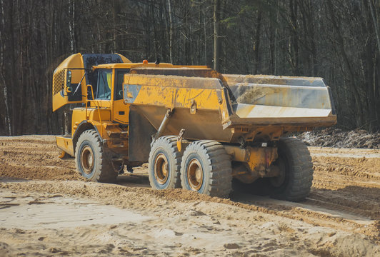 Broken sand tipper truck on construction site.