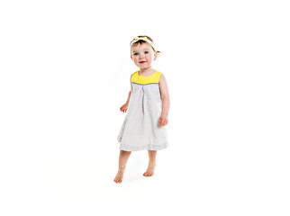 Portrait of a young girl with yellow clothes on photo studio