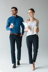 young business partners in stylish clothes on white