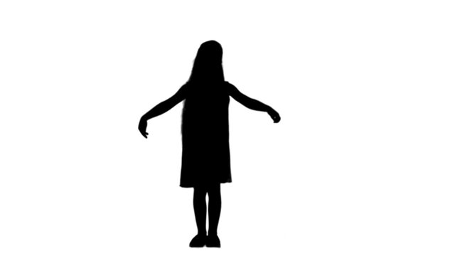 Silhouette Young lady is dressed up in lovely dress and white shoes singing a song track matte