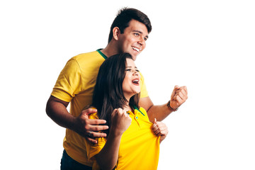 Brazilian couple fan celebrate on white background