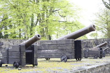 Antique huge cannons defending Bunratty Castle in Ireland
