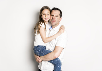 Fototapeta premium girl with his father, isolated on white wall