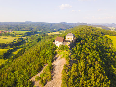 Aerial view of castle Tocnik. Gothic fortress from 14th century. Famous tourist attractions in Czech republic, European union.