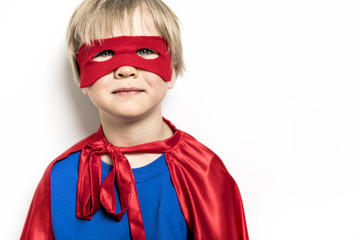 blond Boy superhero in a red cloak isolated on white background