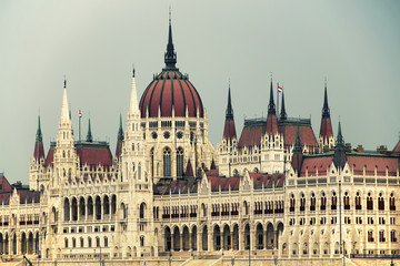 Fototapeta premium Hungarian Parliament in Budapest by the Danube river in sunset light