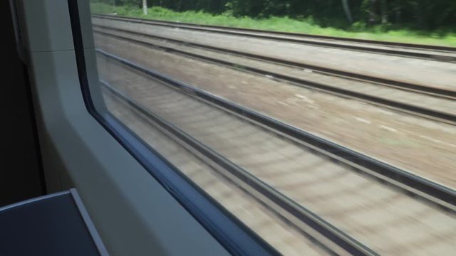 View of railways from moving train window