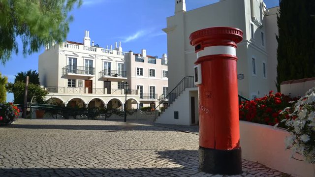 Timelapse of UK red letter pillbox bollard at the Old Village, a tranquil setting in The Algarve, surrounded by the Pinhal Golf Course and close to pristine beaches