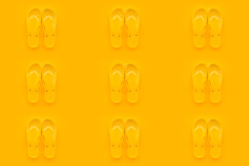 Seamless pattern background of yellow flip flops