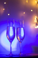 Champagne glass in disco party bar