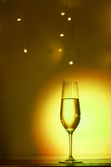 Champagne glass in disco party bar