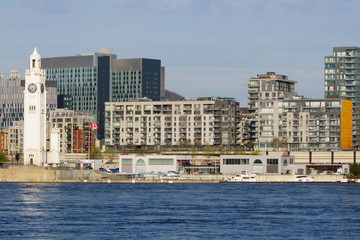 The Clock Tower surrounded by condos in the old port of Montreal                             