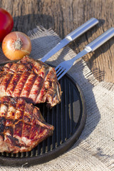 Stack on the grill. Fried meat. Fille on the frying pan.