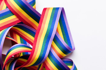 Gay pride LGBT rainbow ribbon on white background