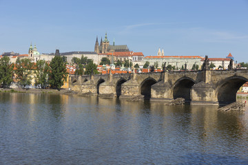 Obraz premium Spring Prague gothic Castle with the Lesser Town above River Vltava in the sunny Day, Czech Republic