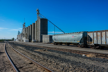 Fototapeta na wymiar Train Cart & Grain Silo