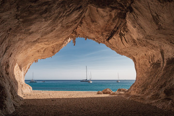 Inside a cave at Cala Luna beach - obrazy, fototapety, plakaty