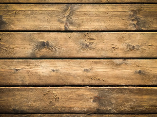 Obraz premium Wooden background with brown horizontal planks. Old and rough wood texture