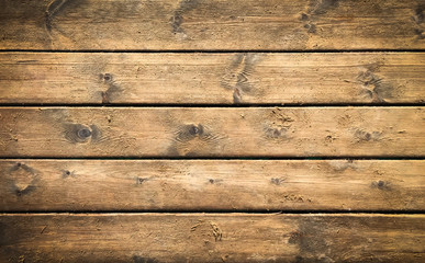 Obraz premium Wooden background with brown horizontal planks. Old and rough wood texture