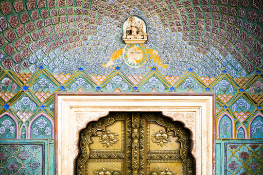 Beautiful and colorful decoration around a typical door of a palace in Jaipur