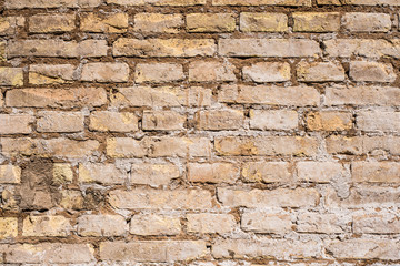 texture of battered, dirty and old brick wall and floor of various colors