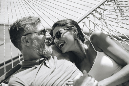 Couple resting together in a hammock