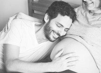 Couple lying in bed together
