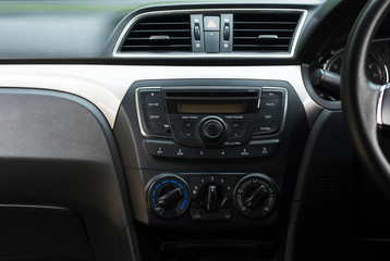 Obraz na płótnie Canvas Car radio and air system,Button on dashboard in dirty car panel