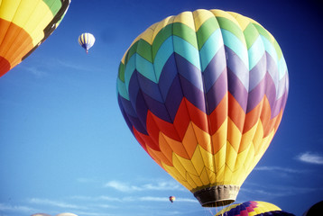 Hot air balloons against blue sky