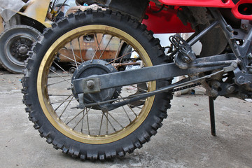 Close-up of muddy rear wheel