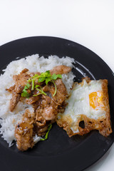 Fried pork with garlic pepper and fried egg on rice