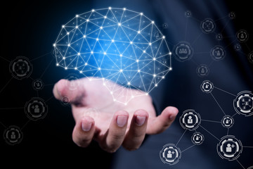 businessman hand holding virtual brain of people network connection