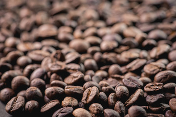 Close up of coffee beans are the background.