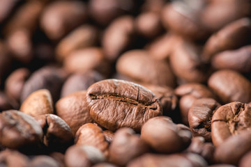 Close up of coffee beans are the background.