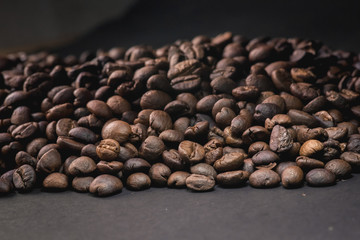 Close up of coffee beans are the background.