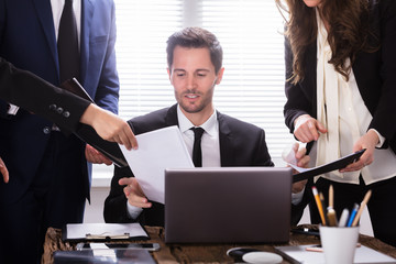 Young Businessman Looking At Document