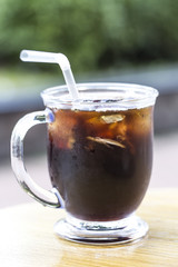Ice americano coffee on wood table background. ice coffee