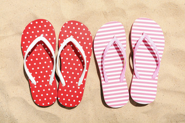 Beach flip flop on sand background