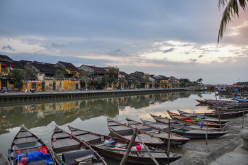 Fototapeta na wymiar Hoi An early in the morning with sun rise and fisherman boats 