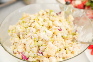 vegetable salad with mayonnaise on a buffet table