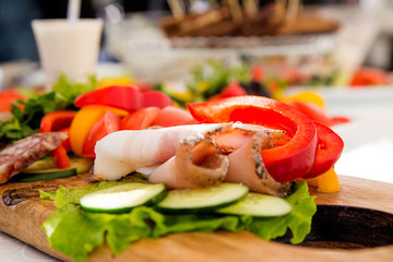 assorted meat and vegetables on the banquet table
