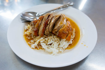 Roasted duck on rice with sauce on rice