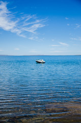 Motor boat in the middle of the lake