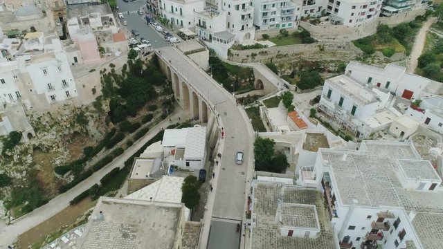 Car drive through the city in Italy Drone flight 4k