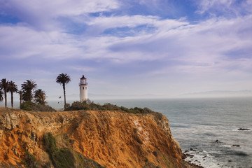 light house on bluff near ocean