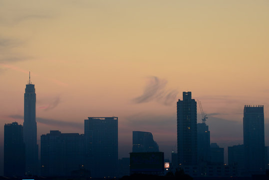 Silhouette of Bangkok city view with beautiful sunrise background © joesayhello